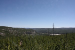 The view from the Summit Lake Trail, looking back toward Biscuit Basin, on the rim above the Upper Geyser Basin. Photographed July 4, 2012.